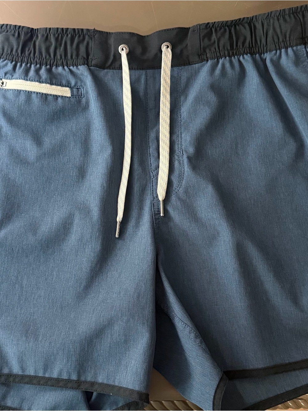 Vuori Men's Athletic Banks Shorts in Slate Blue with Black Waistband. Linerless